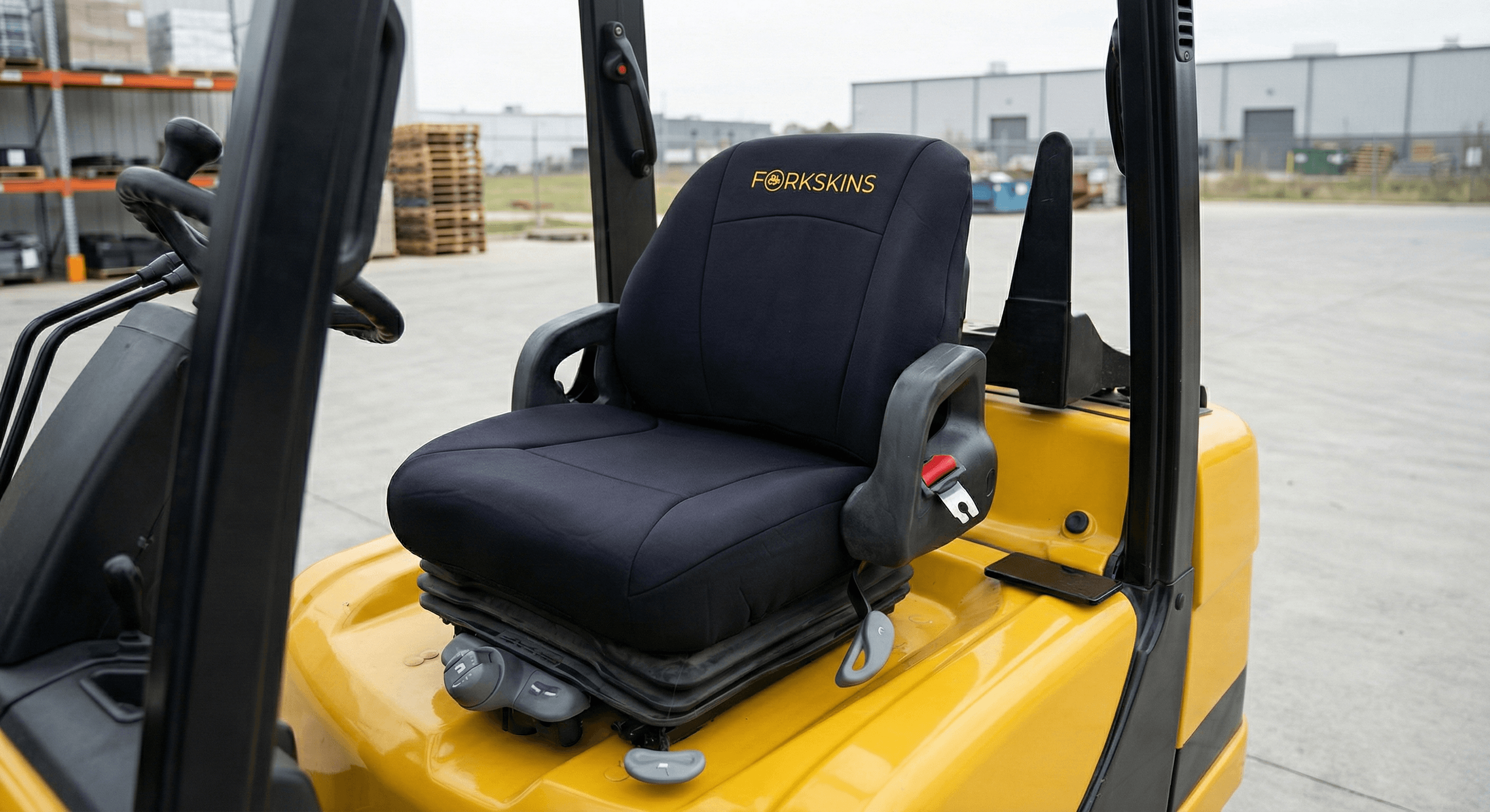 Yellow Hyster forklift outdoors with Forkskins cover installed