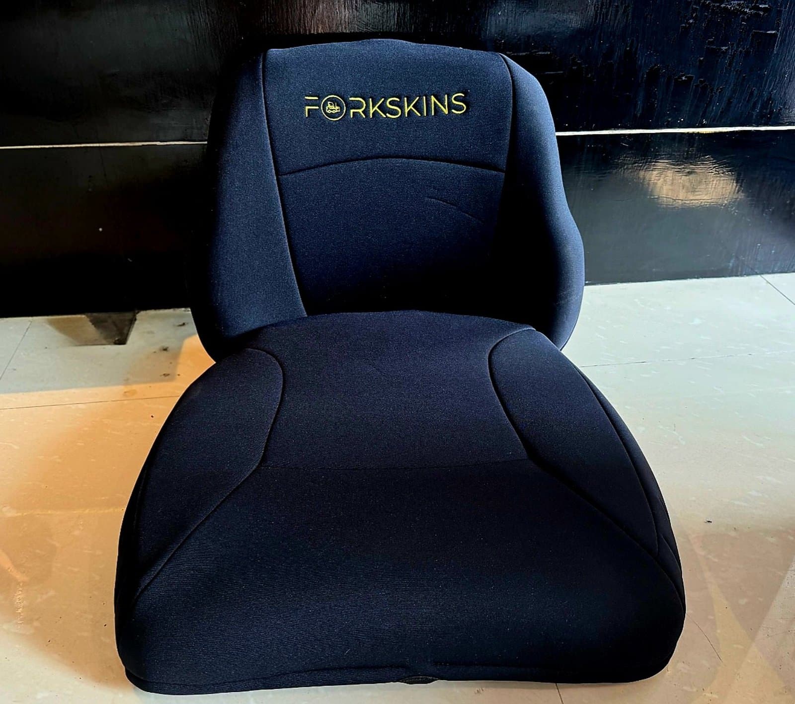 Actual ForkSkins Pro-Fit padded neoprene seat cover set — real product photo with embroidered logo